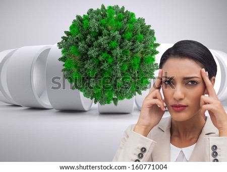 Composite image of young businesswoman putting her fingers on her temples on white background