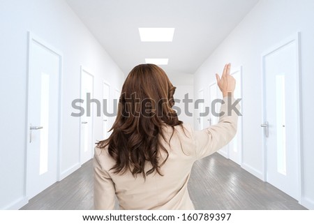 Composite image of brunette businesswoman standing back to camera