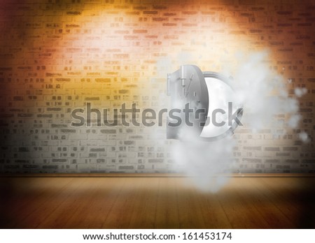 Open safe in dust cloud on brick lined wall