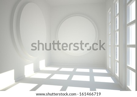 White room with circles at wall and bright windows