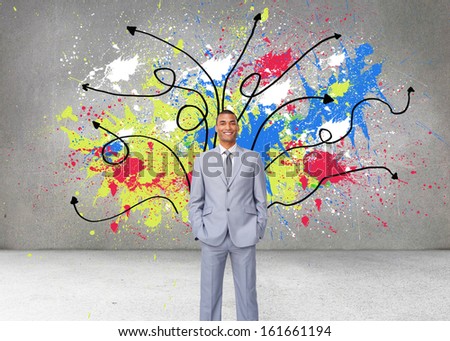 Composite image of attractive businessman with hands in pockets against a white background