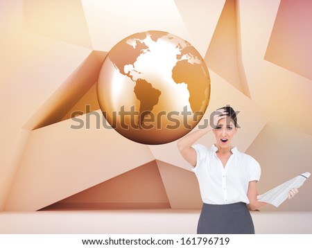 Composite image of shocked classy businesswoman holding newspaper while posing