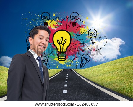 Composite image of colorful light bulbs graphic on bright countryside