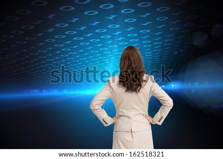 Composite image of businesswoman standing back to camera with hands on hips