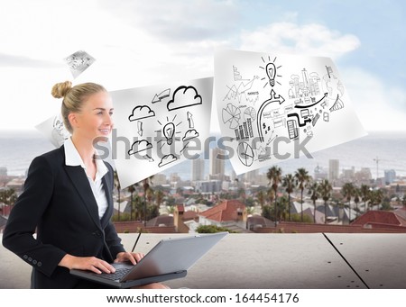 Composite image of blonde businesswoman using laptop