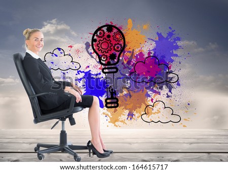 Composite image of attractive blonde businesswoman sitting in swivel chair