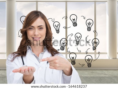 Composite image of smiling brunette doctor presenting her hand
