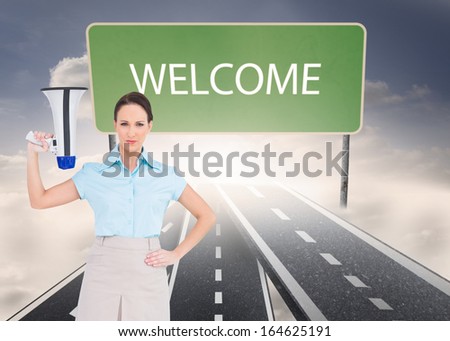 Composite image of stern classy businesswoman holding megaphone while posing