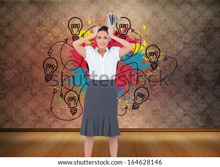 Composite image of worried stylish businesswoman holding newspaper