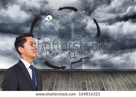 Composite image of graphic on wall with stormy sky