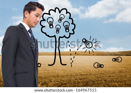 Composite image of light bulb tree over countryside