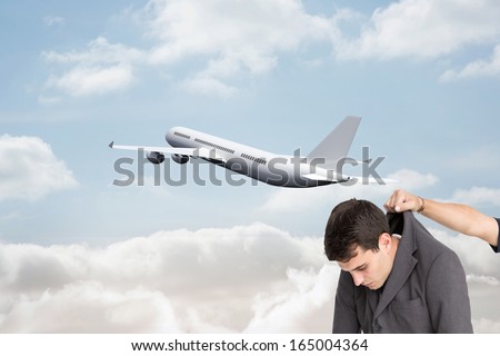 Composite image of businessman hanging - stock photo
