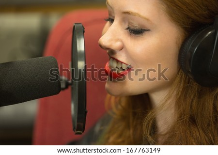 Pretty student presenting a radio show in college