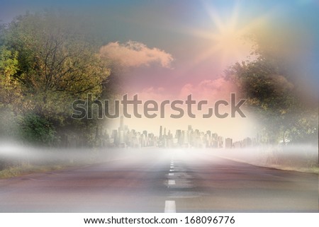 Sunny road leading to city