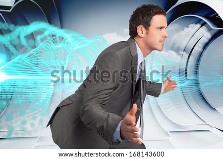 Businessman posing with hands out against blue energy design on a futuristic structure