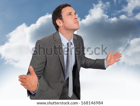 Businessman posing with hands out against open door at top of stairs in the sky
