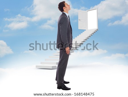Serious businessman with hand in pocket against steps leading to open door in the sky