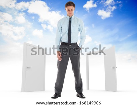 Serious businessman standing with hand in pocket against closed and open doors in sky