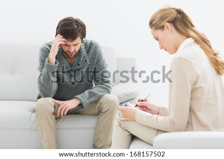 Young man in meeting with a financial adviser at home
