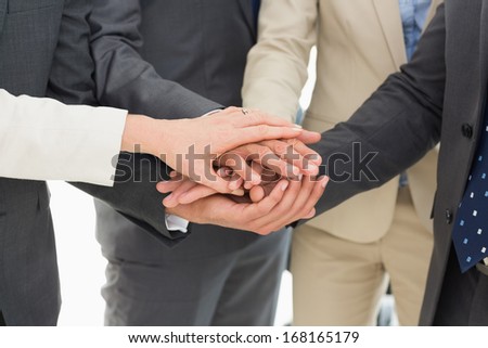 Extreme close-up of a business team joining hands together