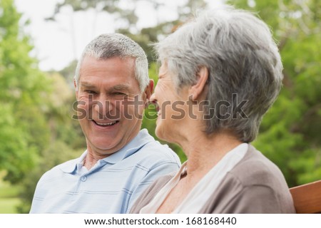 Close-up of a happy senior man and woman looking at each other at the park