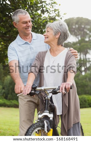 Portrait of a senior couple on cycle ride at the park