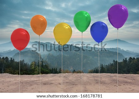 Balloons in front of mountains