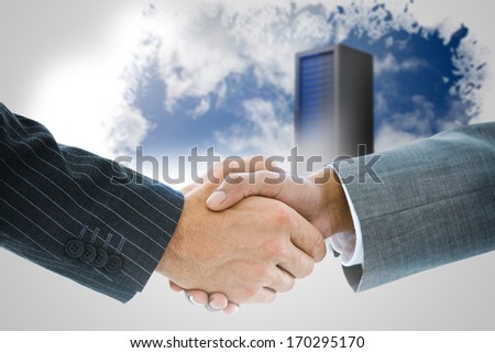 Composite image of business handshake against keyhole on technological black background