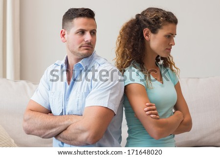 Young couple fighting in living room