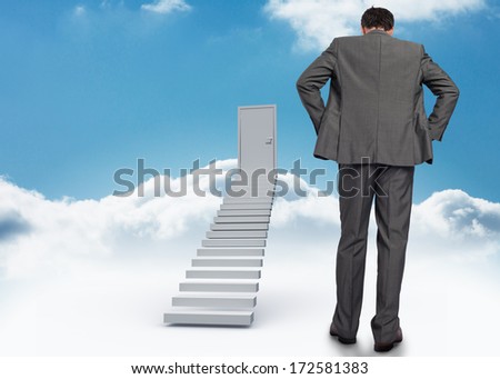 Businessman with hands on hips against shut door at top of stairs in the sky