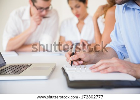 Cropped Image Of Businessman Writing In Diary In Office Meeting
