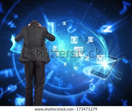 Stressed businessman with hands on head against futuristic blue black background
