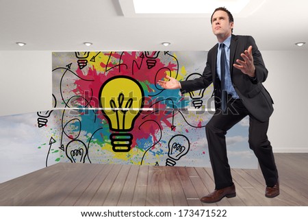 Businessman posing with arms outstretched against digitally generated room with stairs