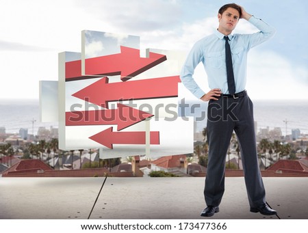 Thoughtful businessman with hand on head against view from balcony over city
