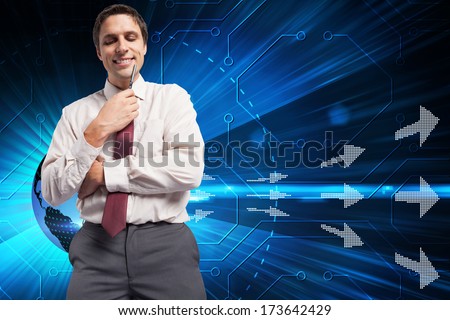Thoughtful businessman holding pen to chin against computer applications