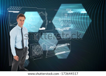 Serious businessman standing with hands in pockets against shiny hexagons on black background