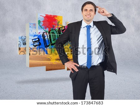 Thinking businessman scratching head against grey wall