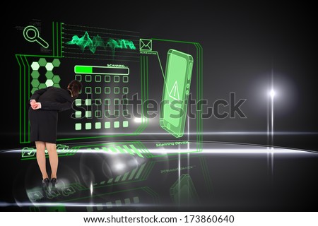 Businesswoman bending against computer applications