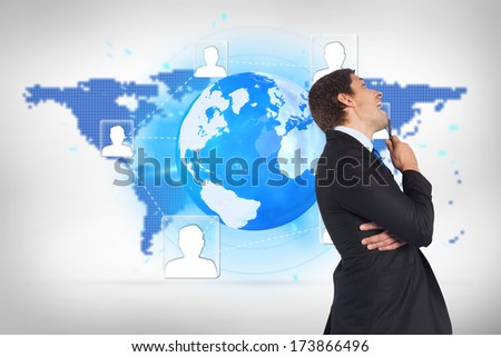 Thinking businessman holding pen against blue world map on white background