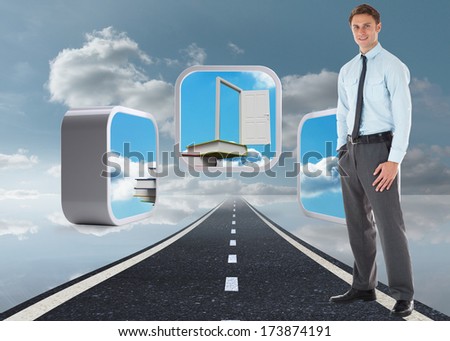 Smiling businessman standing with hand in pocket against road over water reflecting sky