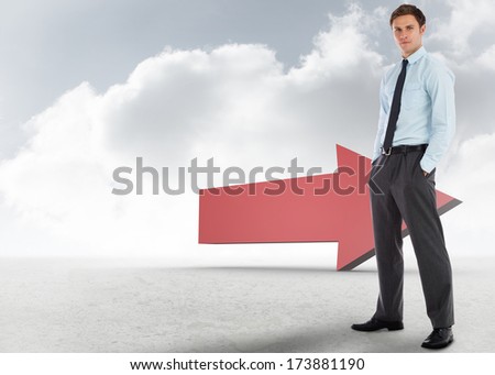 Serious businessman standing with hands in pockets against red arrow in the sky