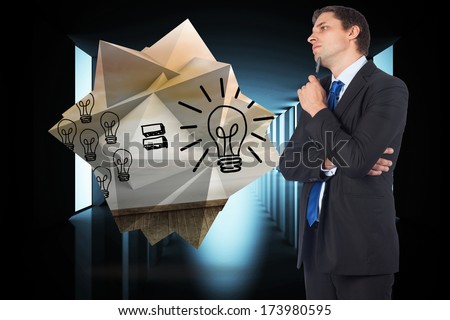 Thinking businessman holding pen against lit up black modern hallway