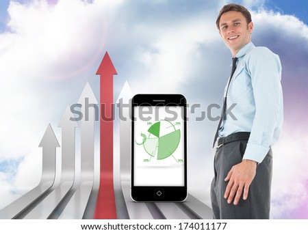 Happy businessman standing against red and grey curved arrows pointing up against sky