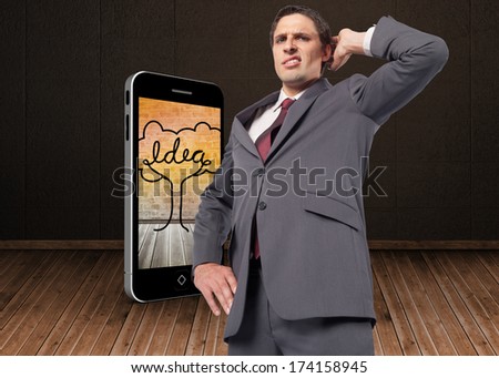 Thinking businessman scratching head against dark room with floorboards
