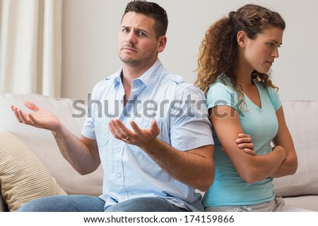 Portrait Of Young Man Gesturing While Arguing With Woman At Home