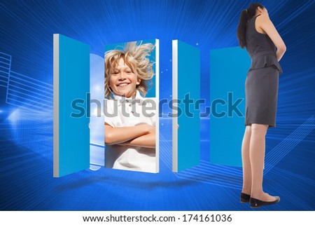 Thinking asian businesswoman against shiny light bulb on blue background