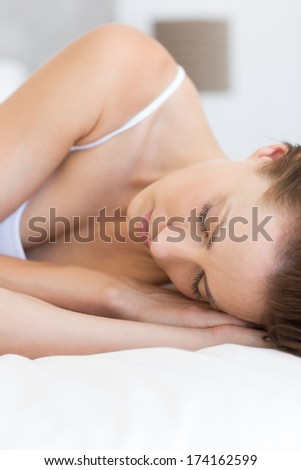Closeup of a pretty young woman sleeping in bed at home