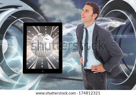Cheerful businessman standing with hands on hips against cloud and energy design on a futuristic structure