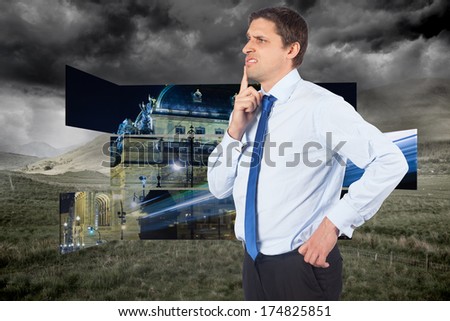 Thinking businessman touching his chin against stormy countryside background