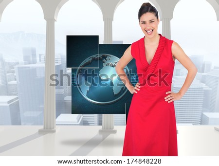 Happy elegant model in red dress posing against bright room with columns